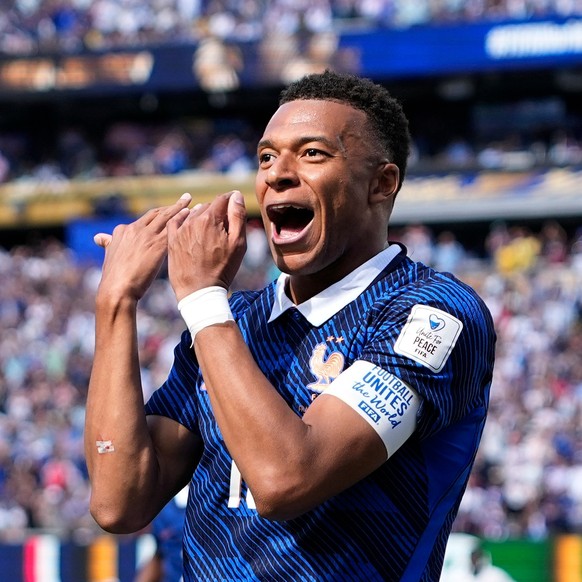 France's Kylian Mbappe celebrates after scoring the opening goal of his team during the World Cup Group I soccer match between France and Senegal in East Rutherford, N.J., near New York, Tuesday, ...