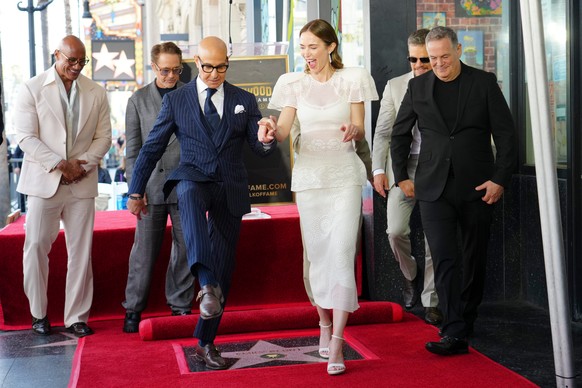 Stanley Tucci, left front, and Emily Blunt pose during a ceremony honoring the two with stars on the Hollywood Walk of Fame in Los Angeles, on Thursday, April 30, 2026. (Photo by Jordan Strauss/Invisi ...