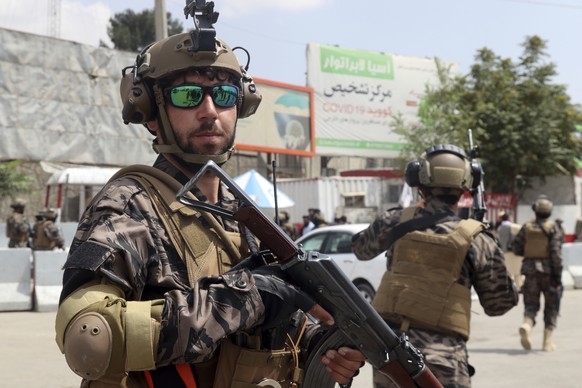 Taliban special force fighters stand guard outside the Hamid Karzai International Airport after the U.S. military's withdrawal, in Kabul, Afghanistan, Tuesday, Aug. 31, 2021. The Taliban were in full  ...