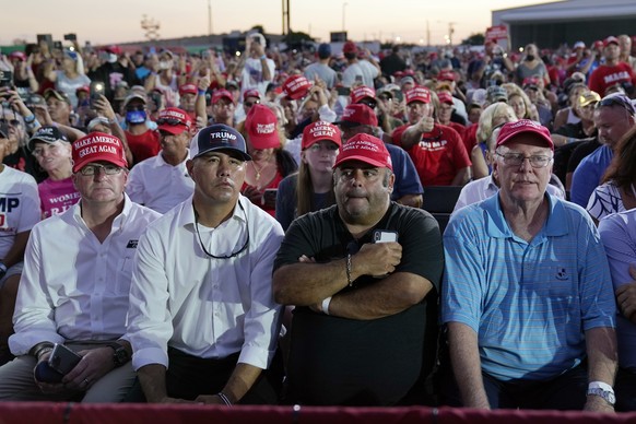 Supporters listen as President Donald Trump speaks during a campaign rally at Orlando Sanford International Airport, Monday, Oct. 12, 2020, in Sanford, Fla. (AP Photo/Evan Vucci)
Donald Trump