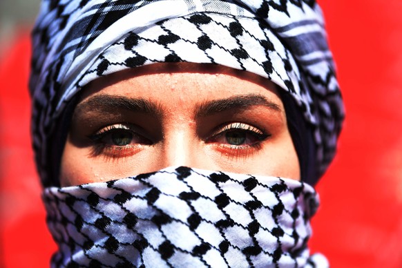 epa08215012 An Iraqi woman takes part in a demonstration at the Al-Tahrir square in central Baghdad, Iraq, 13 February 2020. Hundreds of Iraqi women staged a demonstration in central Baghdad to suppor ...