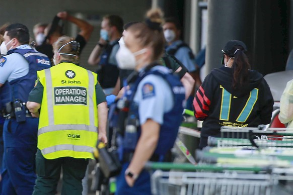 Police and ambulance staff attend a scene outside an Auckland supermarket, Friday, Sep. 3, 2021. New Zealand authorities say they shot and killed a violent extremist after he entered a supermarket and ...