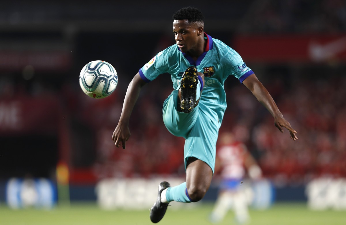 FILE - In this Saturday, Sept. 21, 2019 file photo, Barcelona's Ansu Fati controls the ball during the Spanish La Liga soccer match between Barcelona and Granada at the Los Carmenes stadium in Gr ...