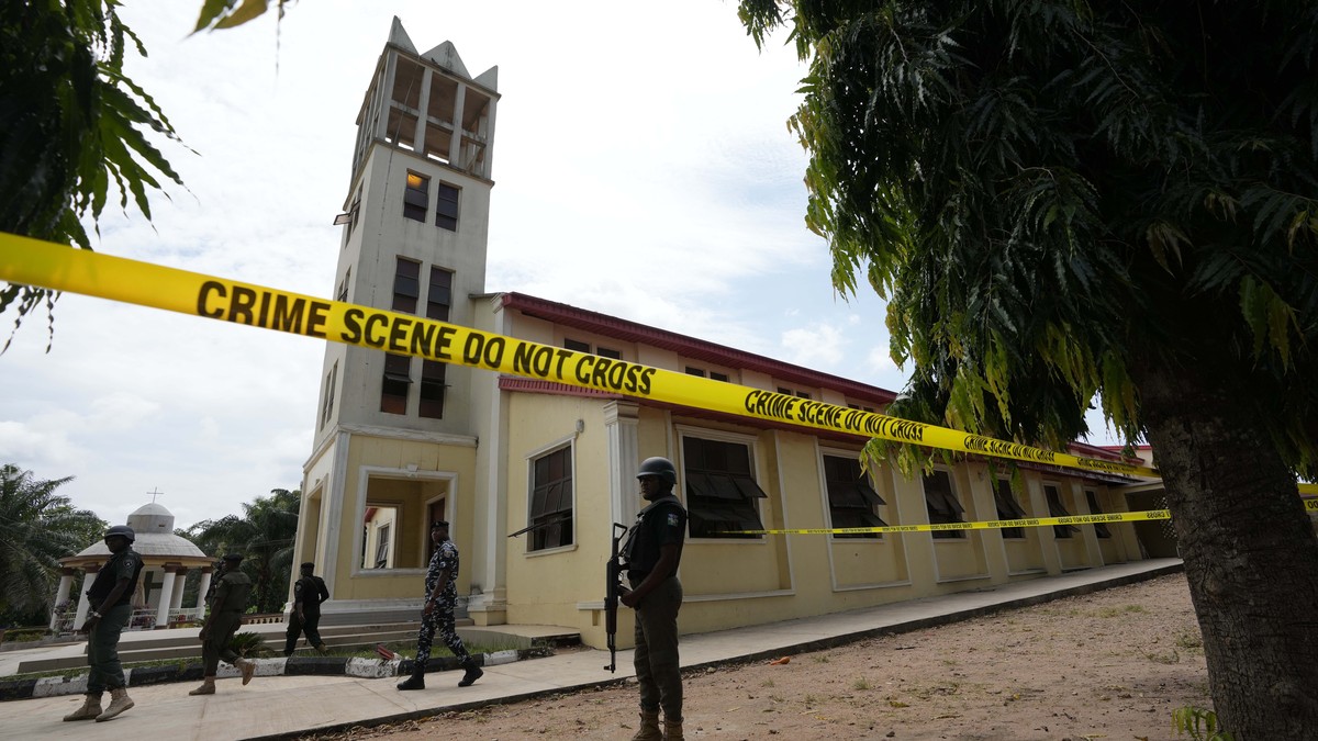 Nigerian police stand guard outside of the St. Francis Catholic church in Owo, Nigeria, Monday, June 6, 2022 a day after an attack that targeted worshipers. The gunmen who killed 50 people at a Cathol ...
