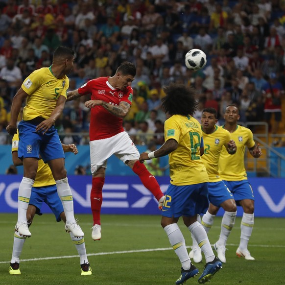 Switzerland&#039;s Steven Zuber, center, heads for the ball to score during the group E match between Brazil and Switzerland at the 2018 soccer World Cup in the Rostov Arena in Rostov-on-Don, Russia,  ...