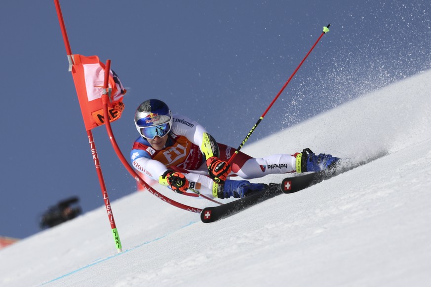 Switzerland&#039;s Marco Odermatt speeds down the course during an alpine ski, men&#039;s World Cup giant slalom, in Meribel, France, Saturday, March 19, 2022. (AP Photo/Marco Trovati)