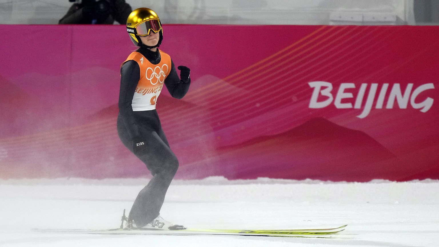 epa09735600 Katharina Althaus of Germany during the Mixed Team Ski Jumping Normal Hill first round at the Zhangjiakou National Ski Jumping Centre at the Beijing 2022 Olympic Games, Zhangjiakou, China, ...