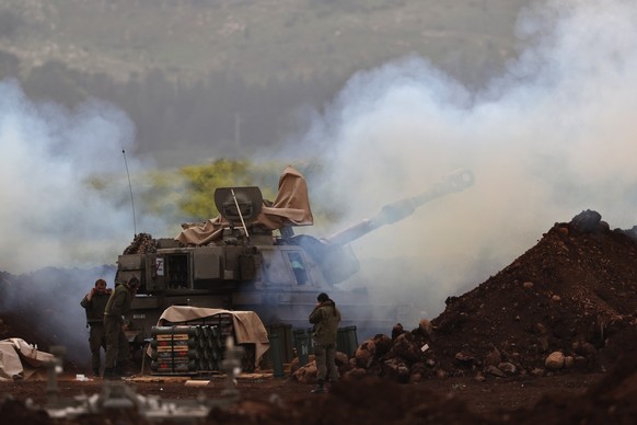epa12819280 ?An Israeli artillery unit deployed at an undisclosed location at the Israeli border with Lebanon shells targets in Lebanon, 14 March 2026. The Israeli military stated it is conducting str ...