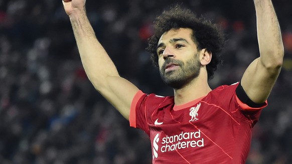 epa09636800 Mohamed Salah of Liverpool celebrates after scoring the 1-0 lead from the penalty spot during the English Premier League match between Liverpool and Aston Villa in Liverpool, Britain, 11 D ...