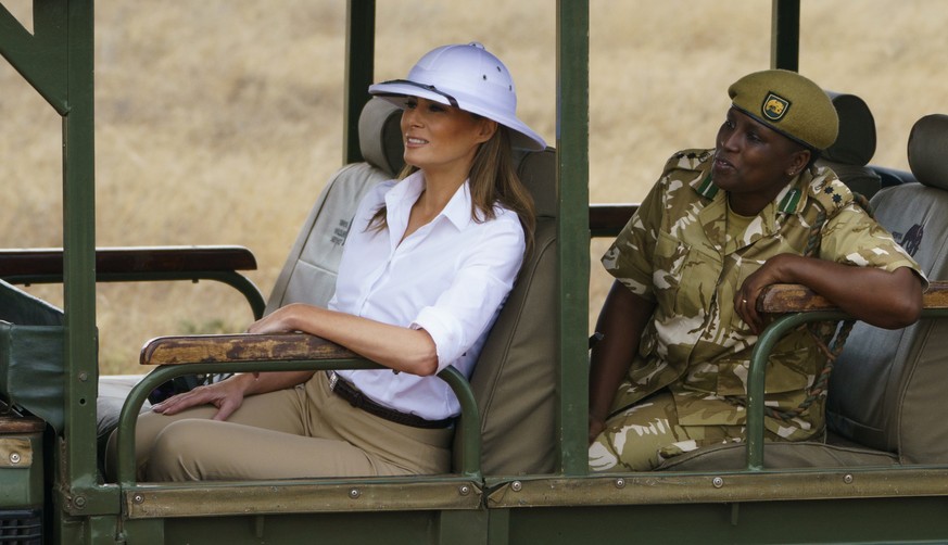 First lady Melania Trump looks out over Nairobi National Park in Nairobi, Kenya, Friday, Oct. 5, 2018, during a safari guided by Nelly Palmeris. Melania Trump has fed baby elephants as she visits a na ...