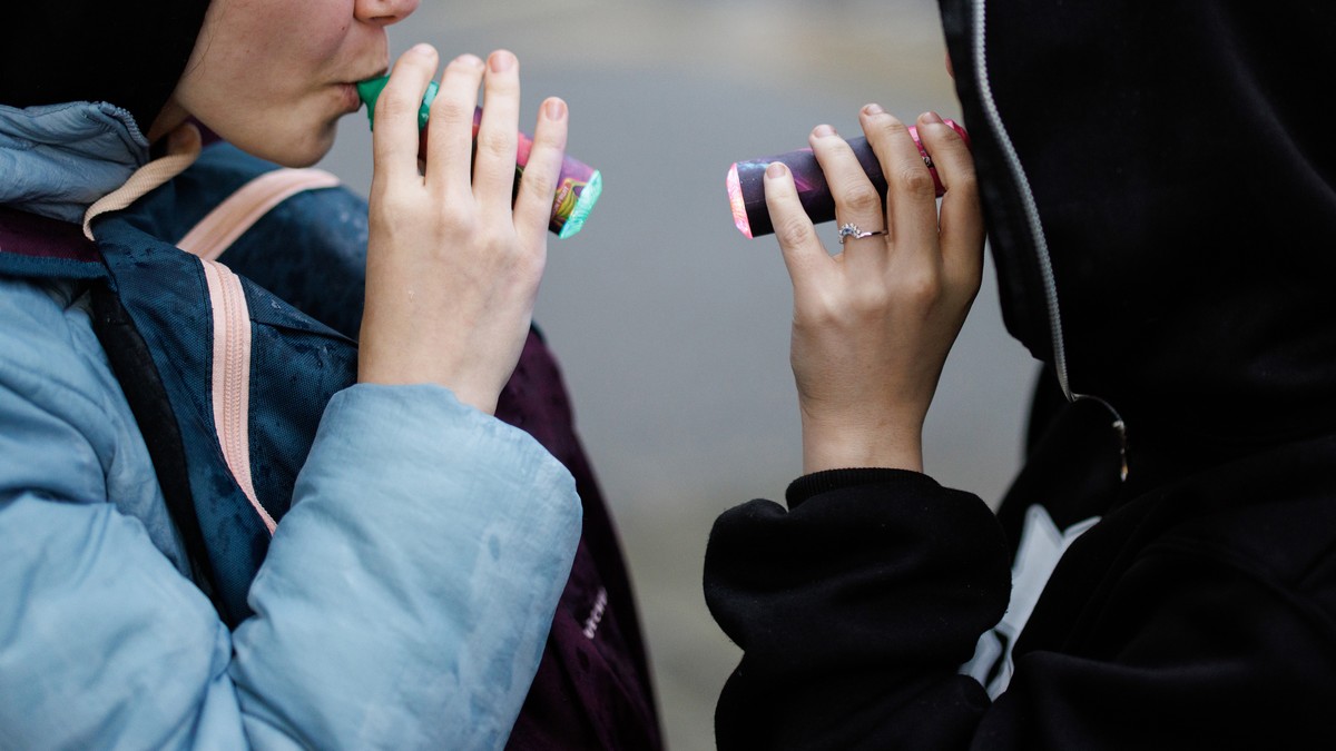epa11245029 Children use vaping products in London, Britain, 26 March 2024. Tadeu Marroco, chief executive of British American Tobacco (BAT), claims the UK government's Tobacco and Vapes Bill, wh ...