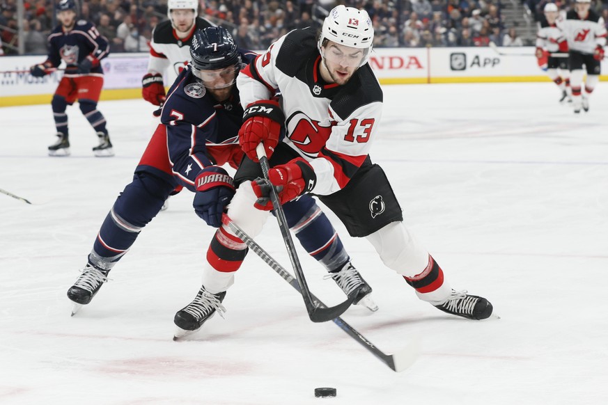 Columbus Blue Jackets&#039; Sean Kuraly, left, and New Jersey Devils&#039; Nico Hischier chase the puck during the first period of an NHL hockey game Tuesday, March 1, 2022, in Columbus, Ohio. (AP Pho ...