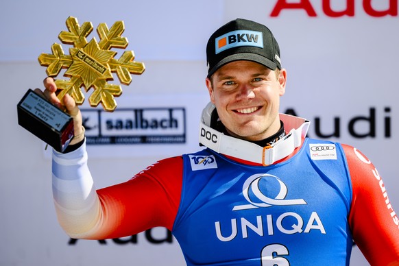 The winner Stefan Rogentin of Switzerland celebrates on the podium during the men&#039;s super-g race at the FIS Alpine Skiing World Cup finals in Saalbach-Hinterglemm, Austria, Friday, March 22, 2024 ...