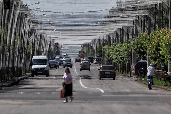 KRAMATORSK, UKRAINE - JUNE 7: Cars drive on a road covered with anti-drone netting on June 7, 2026 in Kramatorsk, Ukraine. Active hostilities continue in Russia’s full-scale war against Ukraine, which ...