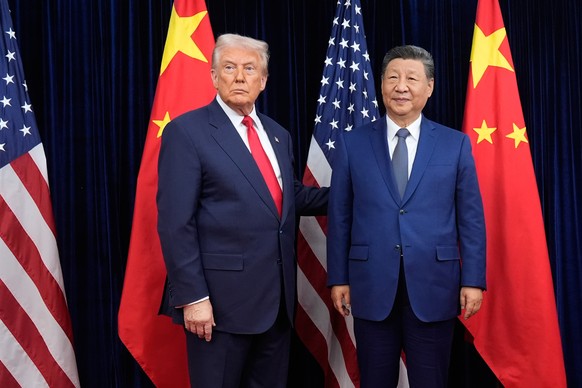 FILE - President Donald Trump, left, and Chinese President Xi Jinping pose ahead of their summit talk at Gimhae International Airport in Busan, South Korea, Oct. 30, 2025. (AP Photo/Mark Schiefelbein, ...