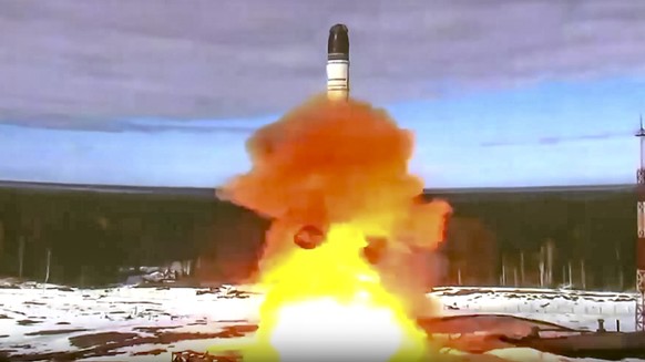 In this handout photo released by Roscosmos Space Agency Press Service on Wednesday, April 20, 2022, the Sarmat intercontinental ballistic missile is launched from Plesetsk in Russia&#039;s northwest. ...
