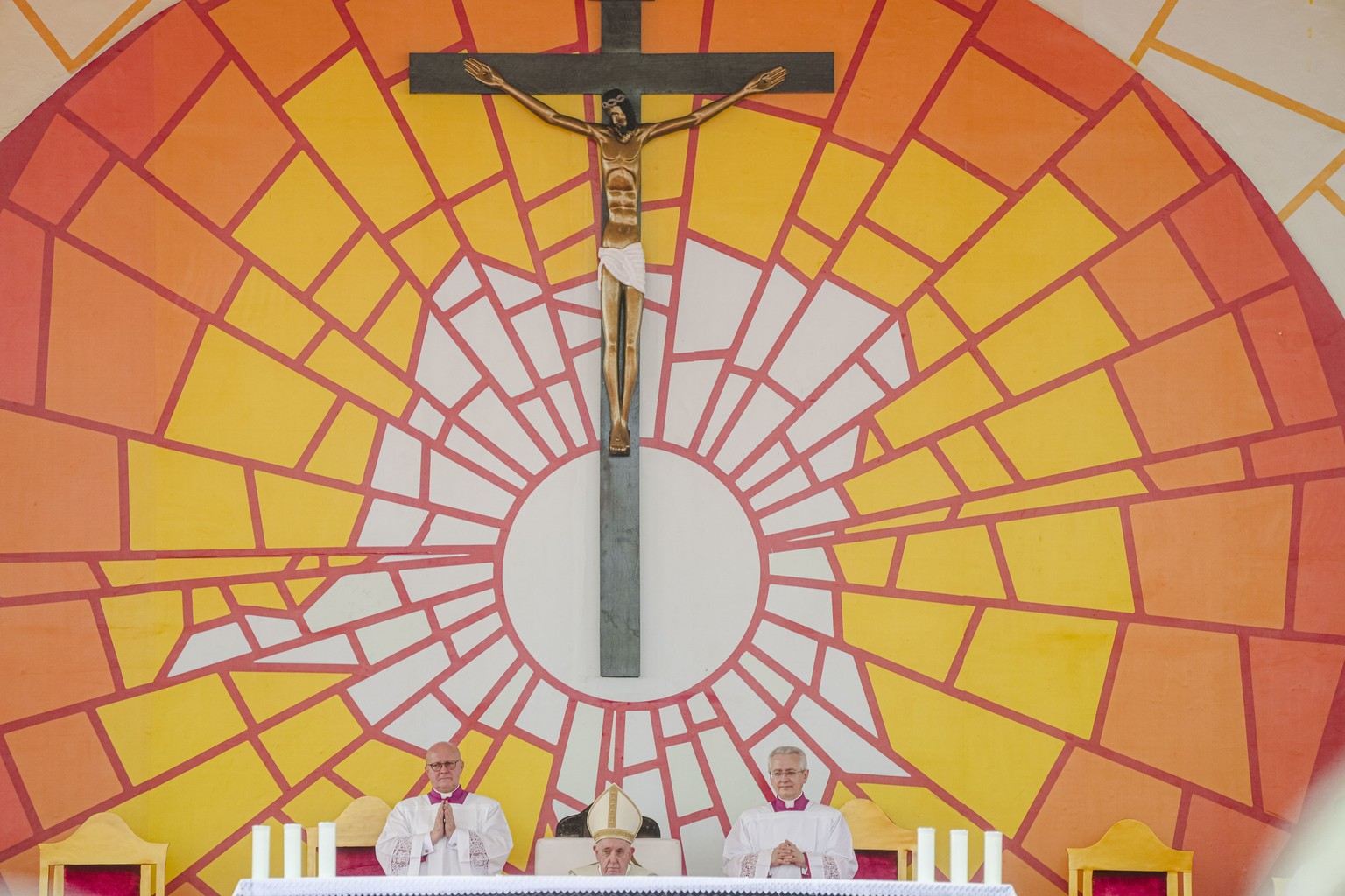 PopeFrancis, center, sits on the altar at Ndolo airport where he will preside over the Holy Mass in Kinshasa, Congo, Wednesday Feb. 1, 2023. Francis is in Congo and South Sudan for a six-day trip, hop ...