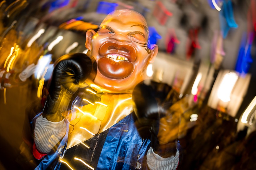 A carnival reveler dressed as the former boxer Mike Tyson parades through the streets during the Monstercorso, the grand finale of the carnival, on Shrove Tuesday, March 4, 2025 in Lucerne, Switzerlan ...