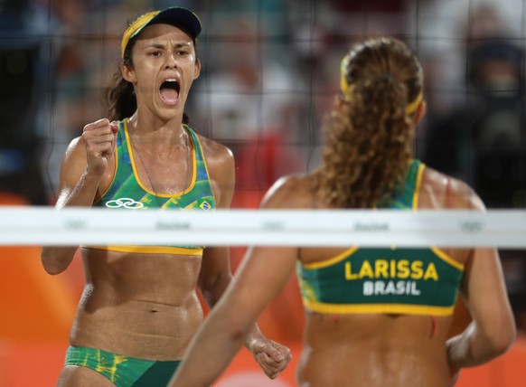 Brazil&#039;s Larissa Franca, right, and Talita Rocha, left, celebrate winning a point during a women&#039;s beach volleyball quarterfinal match against Switzerland at the 2016 Summer Olympics in Rio  ...