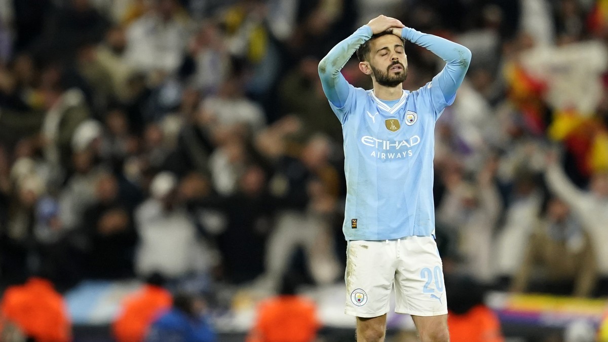 Manchester City's Bernardo Silva reacts after losing the Champions League quarterfinal second leg soccer match against Real Madrid at the Etihad Stadium in Manchester, England, Wednesday, April 1 ...