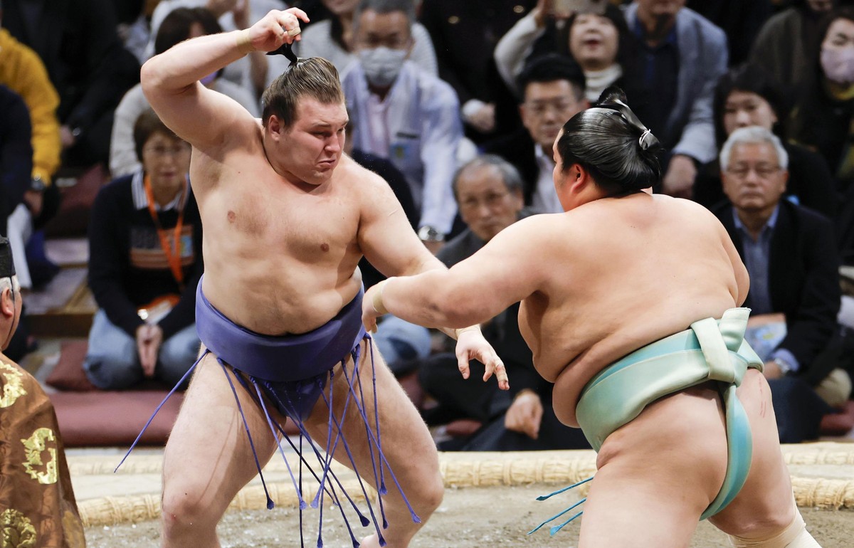 Ukrainian Aonishiki, left, fights with Kotozakura at the Kyushu Grand Sumo Tournament in Fukuoka, western Japan, Sunday, Nov. 23, 2025. (Kyodo News via AP)
Japan Sumo