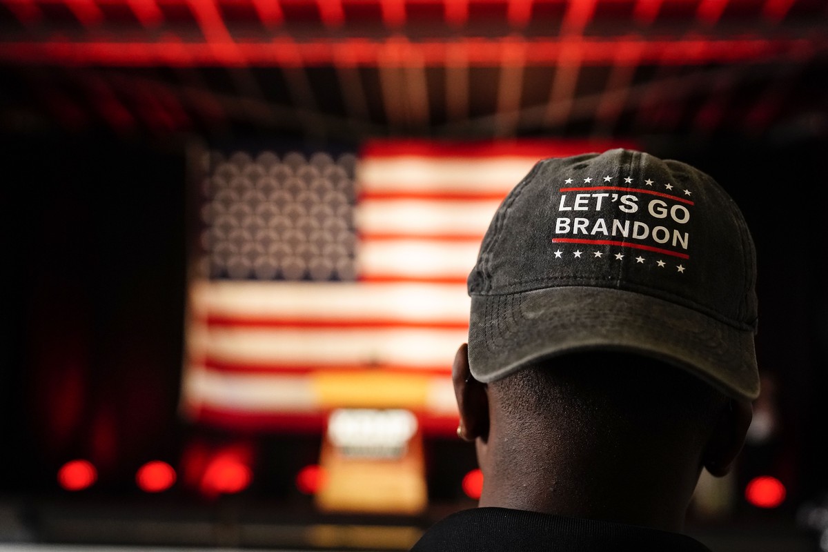 A person wears a "Let's Go Brandon" hat before Georgia Gov. Brian Kemp speaks during a Get Out the Vote Rally, on the eve of gubernatorial and other primaries in the state, on Monday, M ...