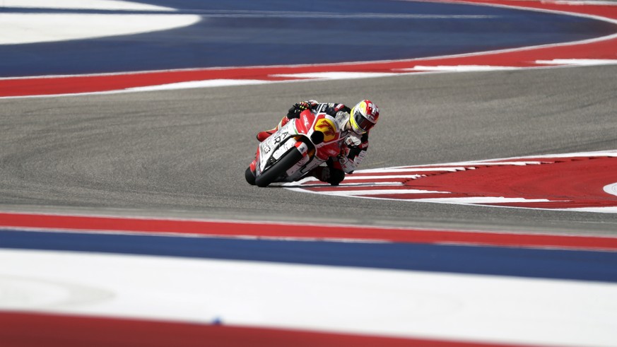 Moto2 rider Dominique Aegerter (77), of Switzerland, steers through a turn during a practice session at the Circuit Of The Americas, Friday, April 12, 2019, in Austin, Texas. (AP Photo/Eric Gay)