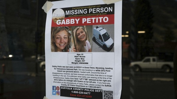 This Thursday, Sept. 16, 2021, photo, shows a Suffolk County Police Department missing person poster for Gabby Petito posted in Jakson, Wyo. Petito, 22, vanished while on a cross-country trip in a con ...