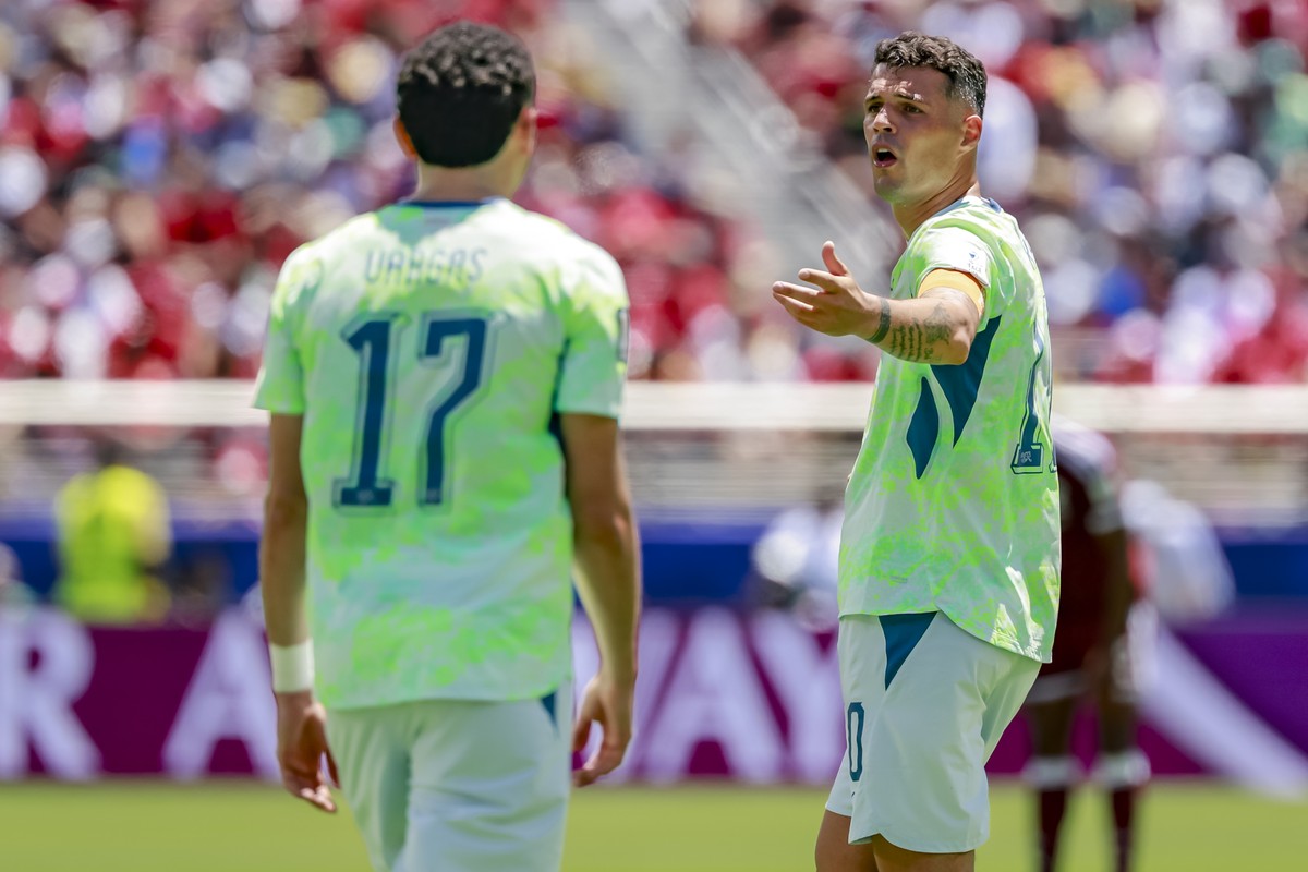 Switzerland's Granit Xhaka, right, reacts next to Switzerland's Ruben Vargas, left, during the World Cup Group B soccer match between Qatar and Switzerland at the San Francisco Bay Area Stad ...