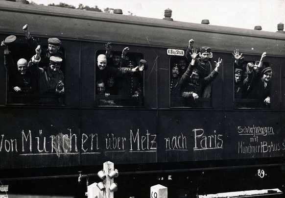 (Original Caption) German troop Transport. Bavarian troops cheerring. Train shows hoped for intinerary, from Munich to Metz, to Paris.