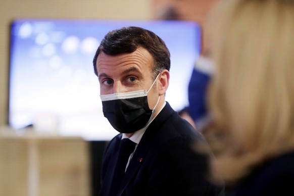 epa09022529 French President Emmanuel Macron attends a viewing meeting of the landing of the NASAて Perseverance Mars rover on the planet Mars at the French National Center for Space Studies (CNES) in ...