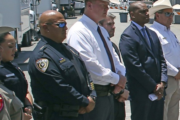 FILE - Uvalde School Police Chief Pete Arredondo, second from left, stands during a news conference outside of the Robb Elementary school in Uvalde, Texas, on May 26, 2022. The Uvalde school district