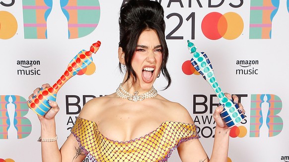 epa09192546 A handout photo made available by the Brit Awards shows Dua Lipa at the Brit Awards 2021 at the O2 Arena in Greenwich, Greater London, Britain, 11 May 2021. It is the 41st edition of the B ...