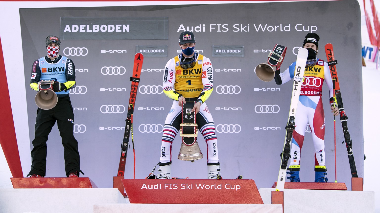 epa08926286 (L-R) Second placed Filip Zubcic of Croatia, winner Alexis Pinturault of France and third placed Marco Odermatt of Switzerland celebrate on the podium of the men&#039;s giant slalom race a ...