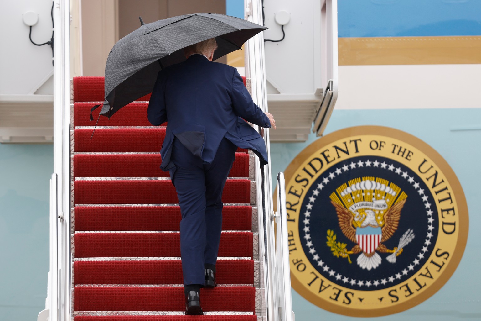 President Donald Trump walks up the stairs of Air Force One as he boards upon his arrival at Joint Base Andrews, Md., Sunday, Oct. 12, 2025. (AP Photo/Luis M. Alvarez)
Trump Mideast Wars