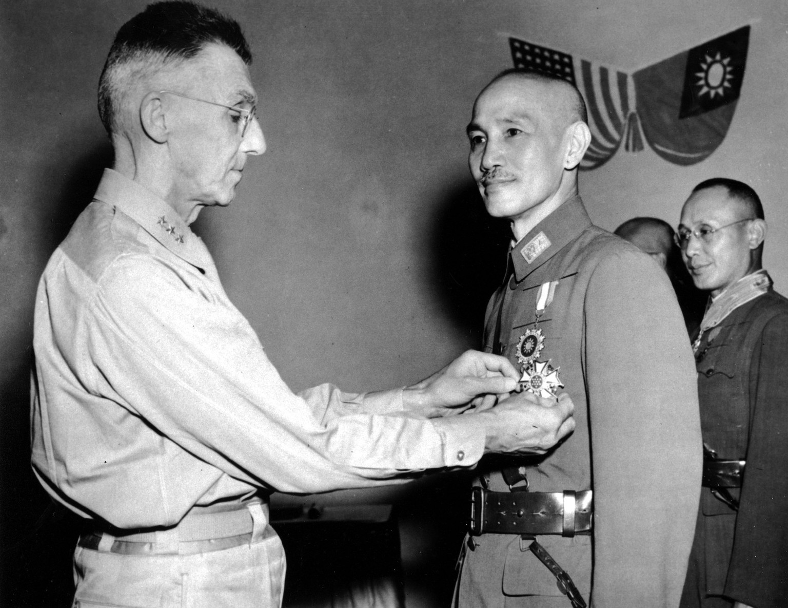 This is an undated photo of U.S. Lt. General Joseph W. Stilwell, left, commander of American Forces in China, Burma, and India, decorating China's General Chiang Kai-Shek with the Legion of Merit ...