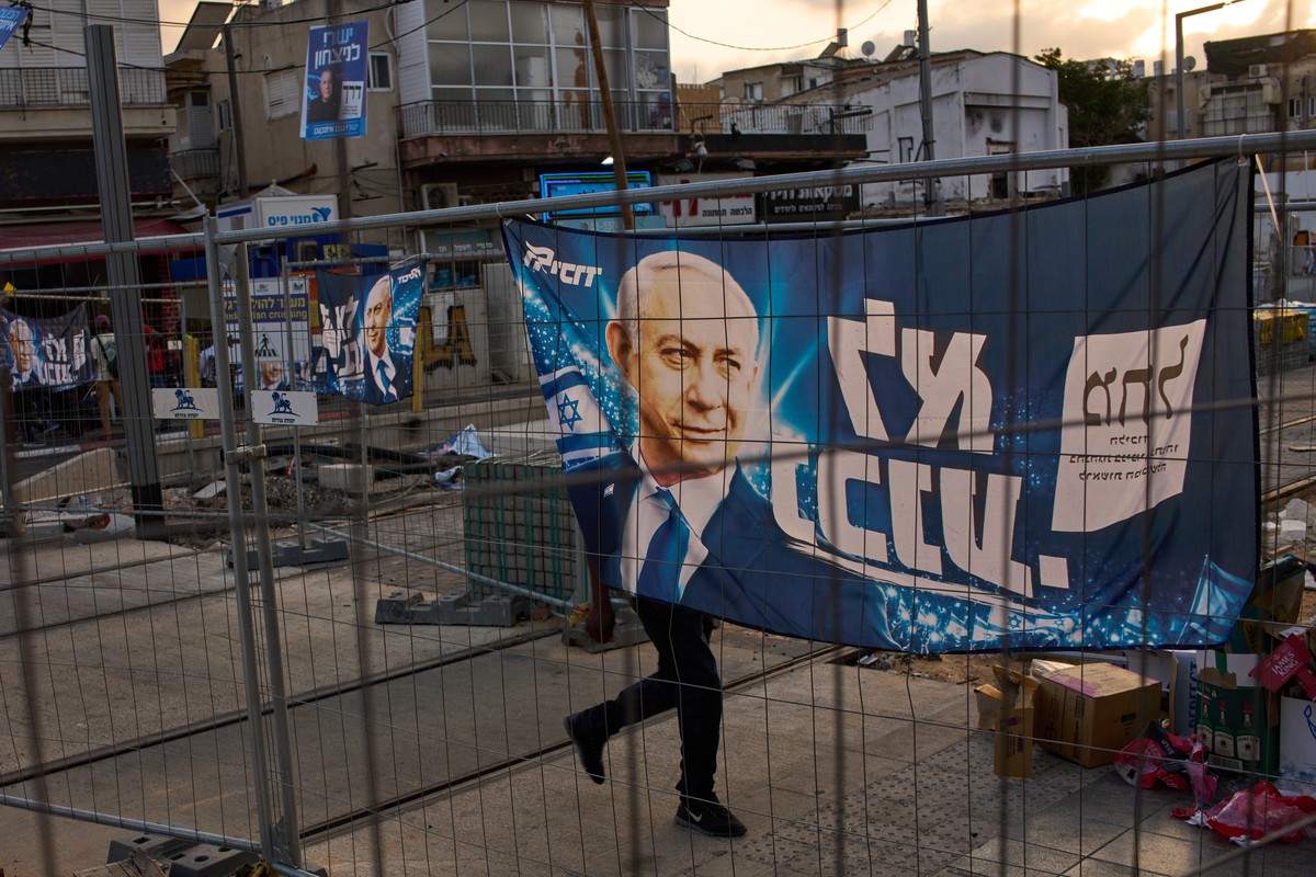 An election campaign banner featuring Israeli Prime Minister Benjamin Netanyahu, leader of the Likud party, hangs on fence ahead of Israel's general election in Tel Aviv, Israel, Friday, Oct. 9,  ...