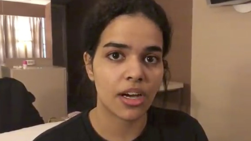 In this Monday, Jan. 7, 2019, image made from video released by Rahaf Mohammed Alqunun/Human Rights Watch, Rahaf Mohammed Alqunan views her mobile phone as she sits barricaded in a hotel room at an in ...