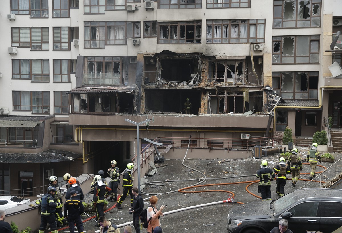 epa12250609 Ukrainian rescuers work at the site of a drone strike on a residential building in Kyiv, Ukraine, 21 July 2025, amid the Russian invasion. At least two people died and 15 people were injur ...