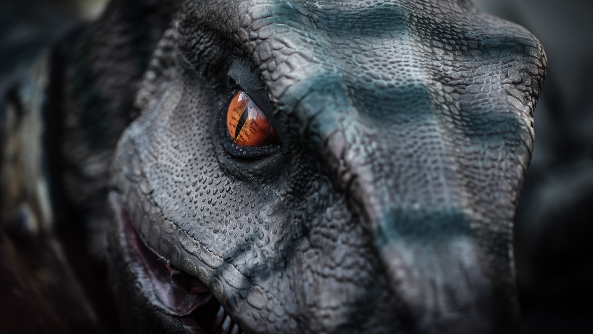 epa10297908 Members of the organisation called 'Pacific Island Students Fighting Climate Change (PISFCC)' stage a protest with dinosaur named Frankie during the 2022 United Nations Climate C ...