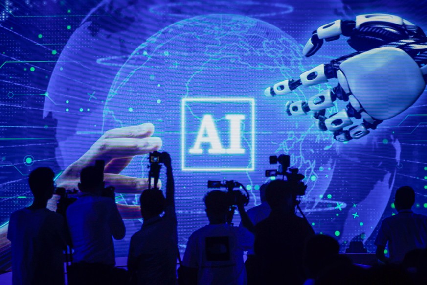 epa10752824 People attend the launch event of the first commercial application of artificial intelligence for the mining industry in Jinan, Shandong province, China, 18 July 2023. Shandong Energy, Hua ...