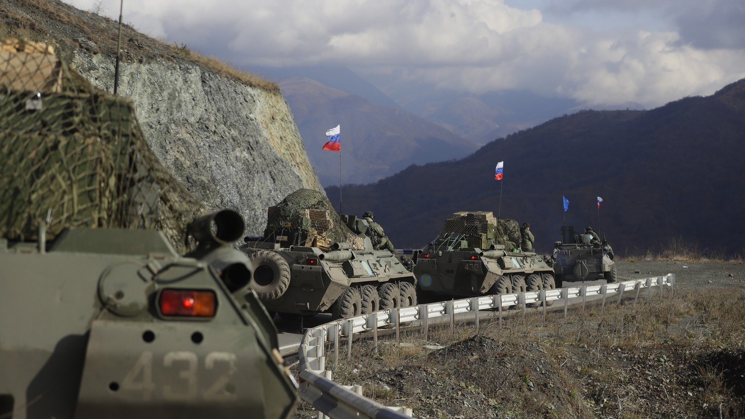 FILE - Russian military vehicles roll along a road towards the separatist region of Nagorno-Karabakh, Friday, Nov. 13, 2020. The war ended with a Russia-brokered armistice under which Azerbaijan regai ...