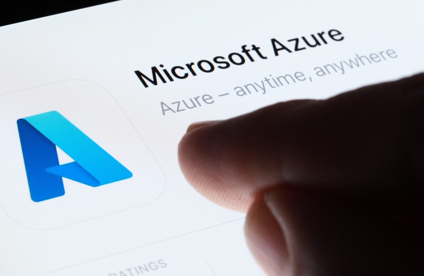 Microsoft Azure app seen in App Store on the screen of ipad and blurred finger pointing at it. Selective focus. Stafford, United Kingdom, May 6, 2023