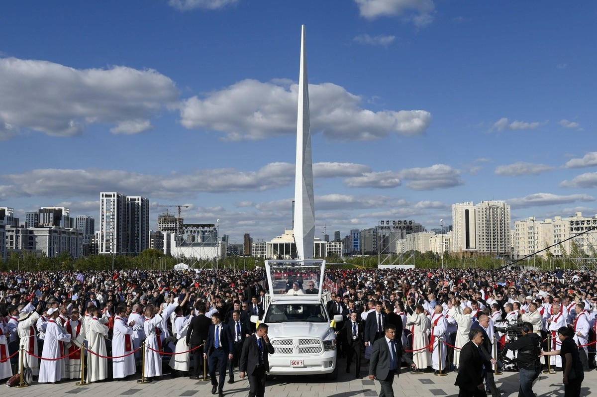 epa10183497 A handout picture provided by the Vatican Media shows Pope Francis (C) on Papamobil leads a holy mass in the Expo Grounds in Nur-Sultan, Kazakhstan, 14 September 2022. EPA/VATICAN MEDIA HA ...