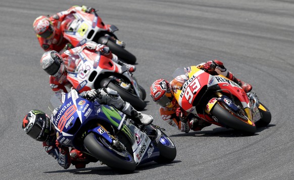 Yamaha MotoGP rider Jorge Lorenzo of Spain takes a curve ahead of Honda MotoGP rider Marc Marquez of Spain (93) the Italian Grand Prix at the Mugello circuit, Italy, May 31, 2015. REUTERS/Max Rossi