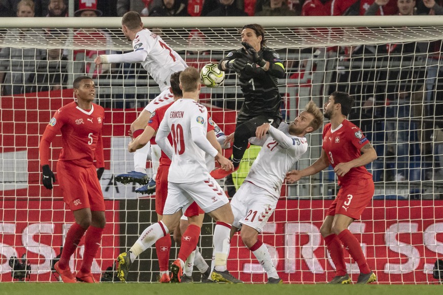 epa07465779 Denmark&#039;s Henrik Dalsgaard, left top, scores the 3-3 against Switzerland&#039;s goalkeeper Yann Sommer, right top, during the UEFA Euro 2020 qualifying Group D soccer match between Sw ...