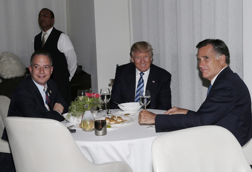 epa05652825 US President-elect Donald Trump (C) sits at a table with Former Governor of Massachusetts Mitt Romney (R) and Chairman of the Republican National Committee Reince Priebus (L) at Jean Georg ...