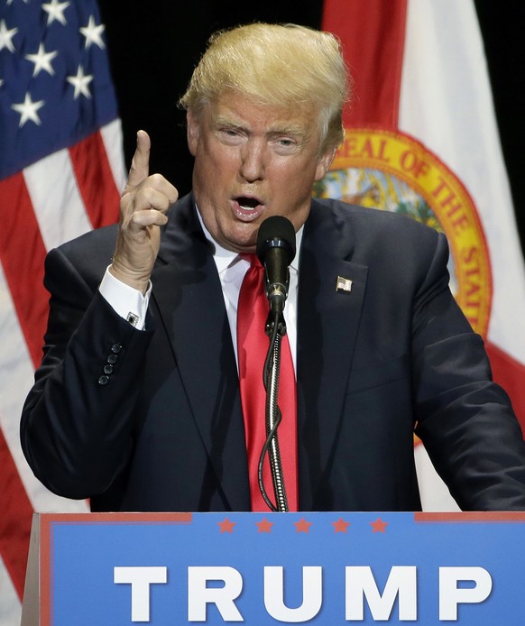 Republican presidential candidate Donald Trump uses his finger to mimic a gun during a campaign speech Saturday, June 11, 2016, in Tampa, Fla. (AP Photo/Chris O&#039;Meara)