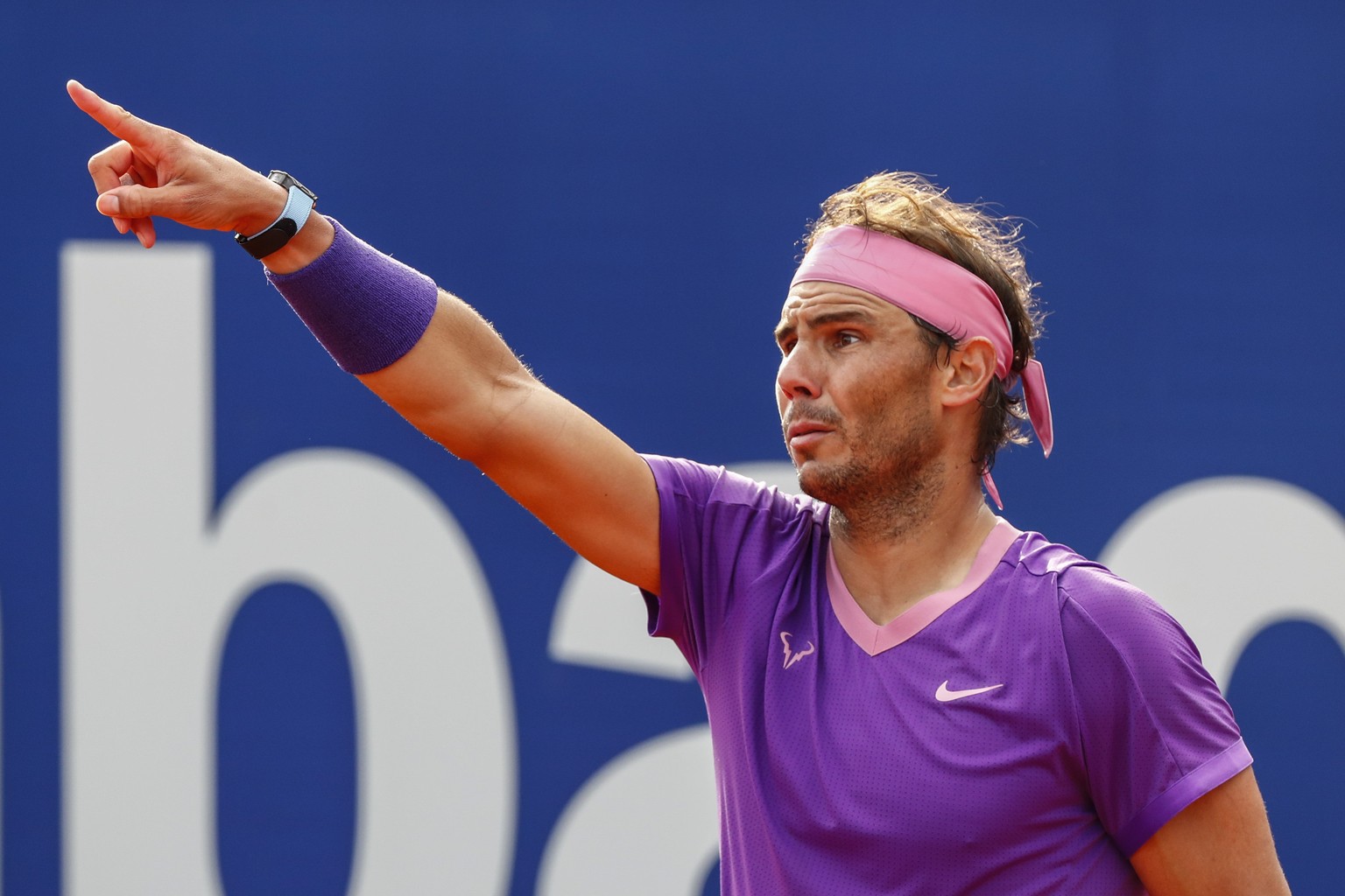 FILE - Spain&#039;s Rafael Nadal gestures during a match against Japan&#039;s Kei Nishikori during the Godo tennis tournament in Barcelona, Spain, April 22, 2021. Rafael Nadal says that he will miss t ...