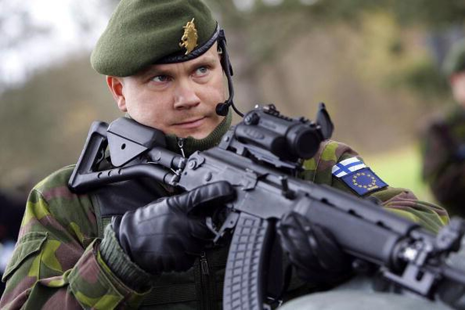 LEIPHEIM, GERMANY - NOVEMBER 21: A Finnish soldier patrols a military checkpoint on November 21, 2006 in Leipheim near Ulm, Germany. Germany, the Netherlands and Finland are working together to streng ...